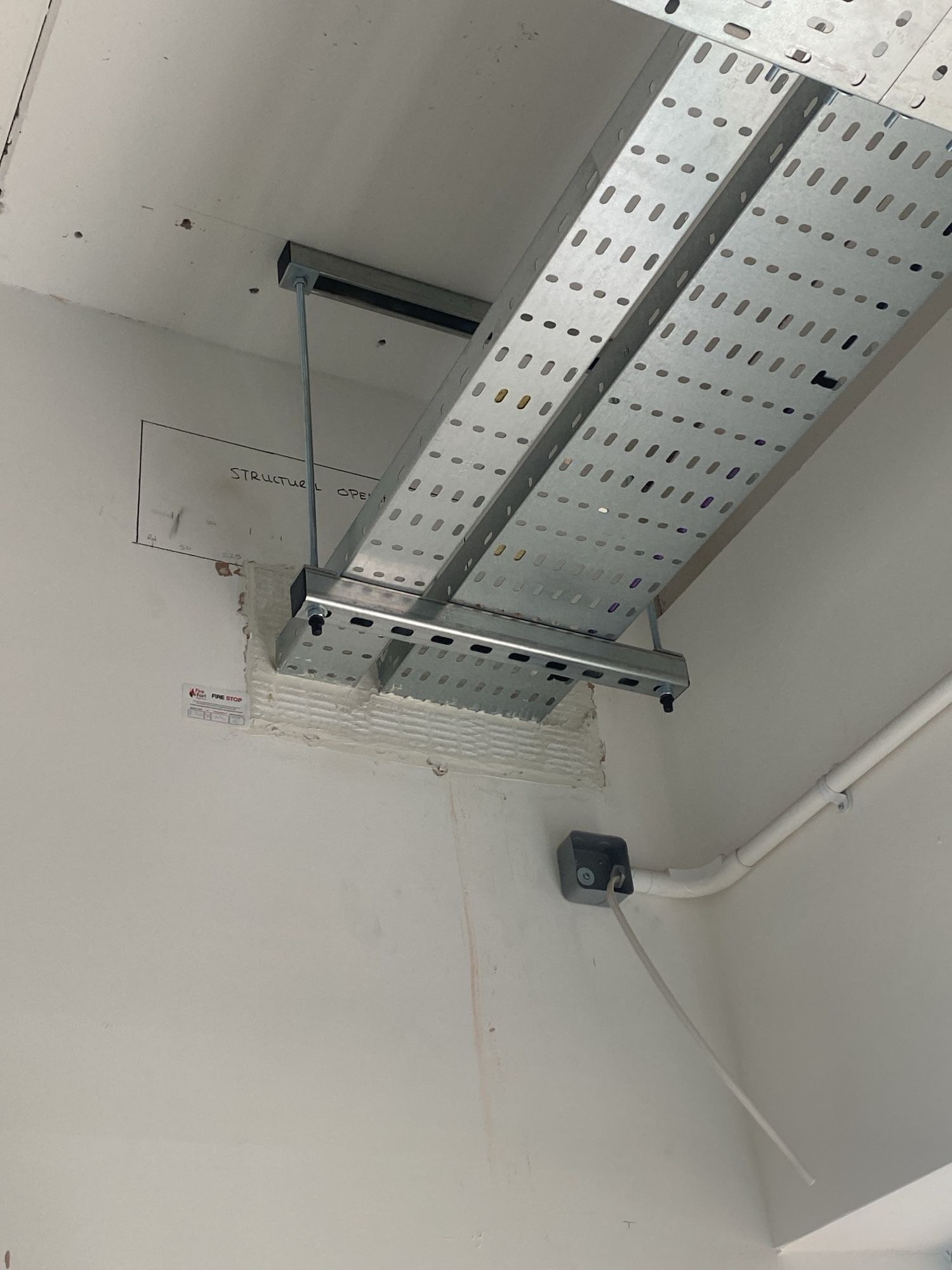 Cable tray fire stopping at a wall penetration, Manchester